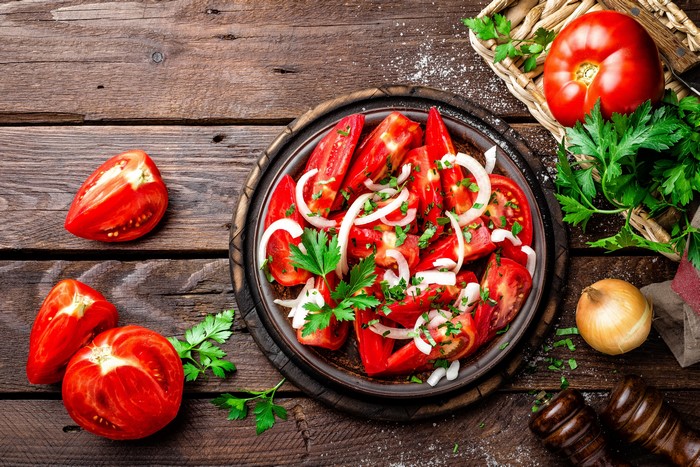Tomato and Onion Salad on Wooden Table