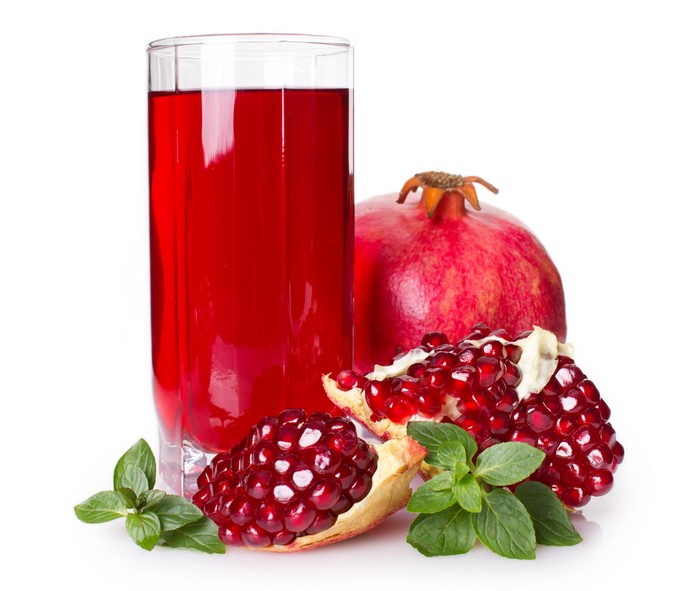 Pomegranate juice with fresh pomegranates and mint