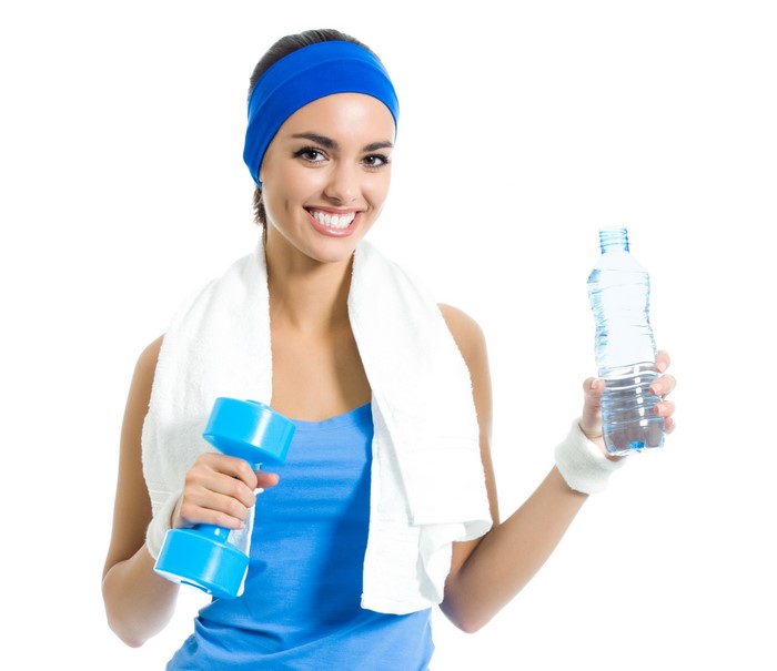 Woman with dumbbell and water bottle