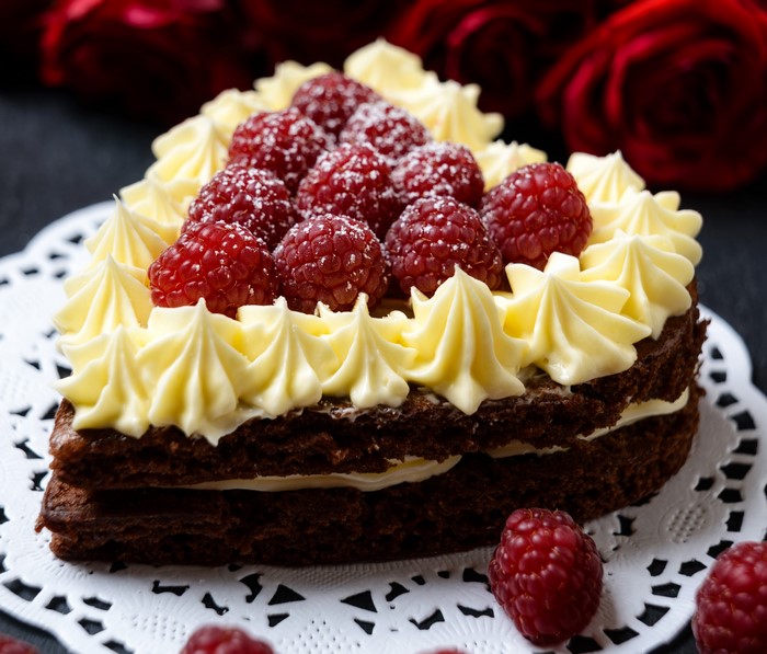 Chocolate cake with raspberries and cream