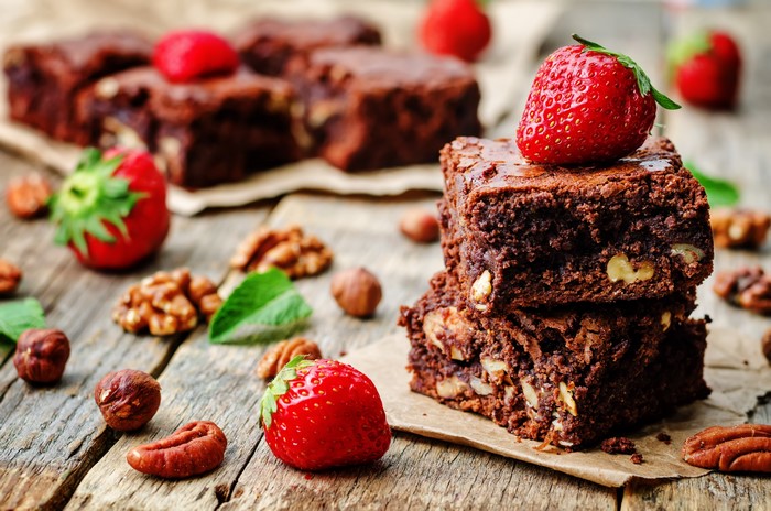Chocolate brownies with strawberries and nuts