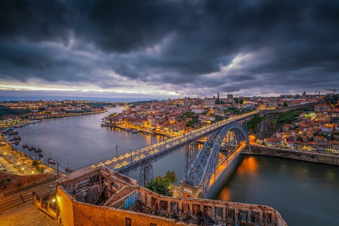 Dom Luís I Bridge over Douro River in Porto, Portugal at dusk