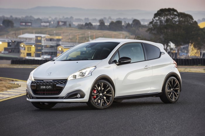 White Peugeot 208 GTi on a Racetrack