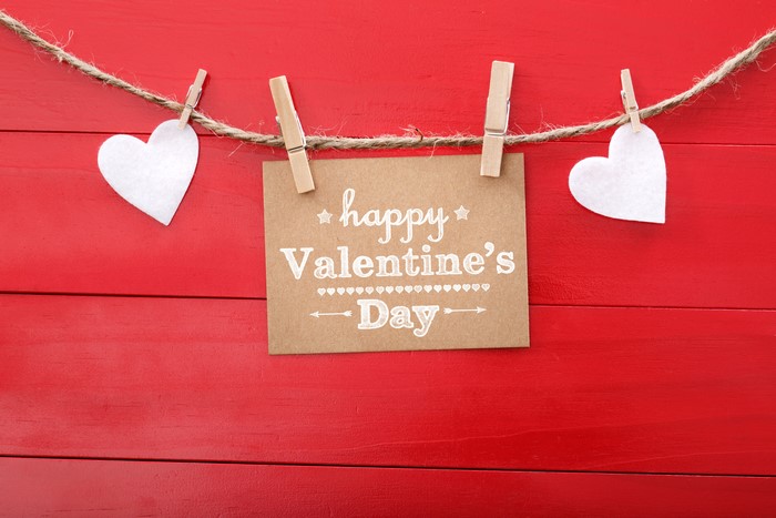 Valentine's Day hearts and message on red background