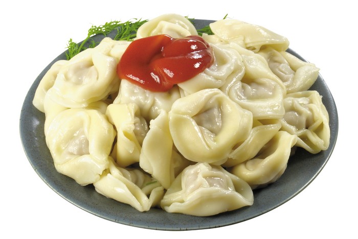 Plate of Pelmeni with Ketchup and Dill