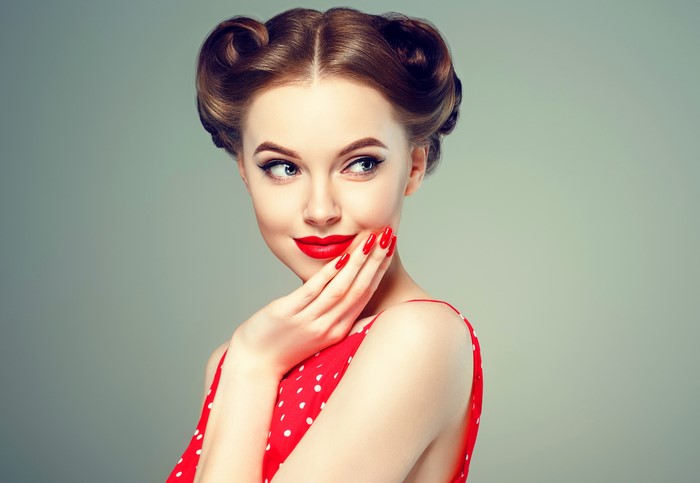 Woman with retro hairstyle and red dress