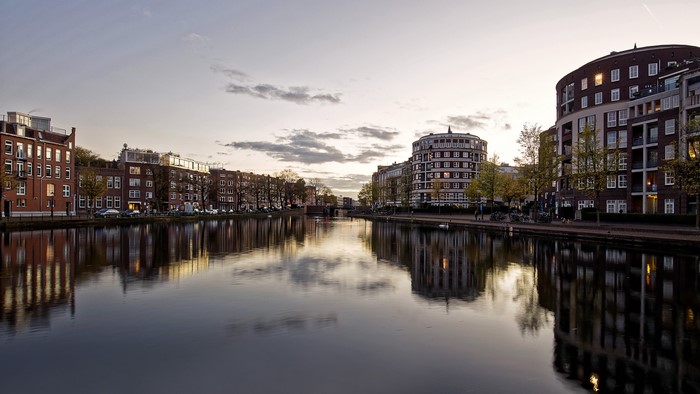 Canal in Amsterdam at Dusk with Buildings Reflected