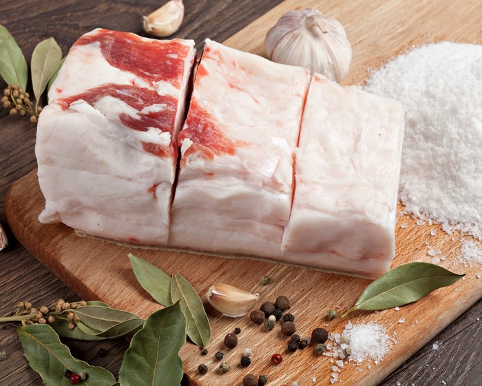 Salo with Garlic, Spices, and Salt on Cutting Board