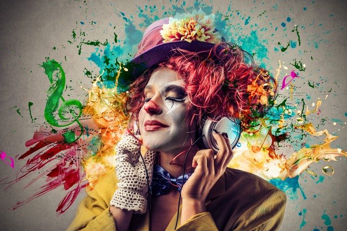 Clown with headphones listening to music