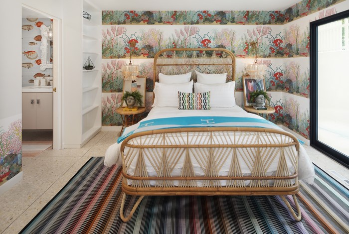 Bedroom with Rattan Bed and Coral Wallpaper