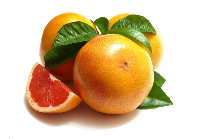 Grapefruit with leaves and a slice