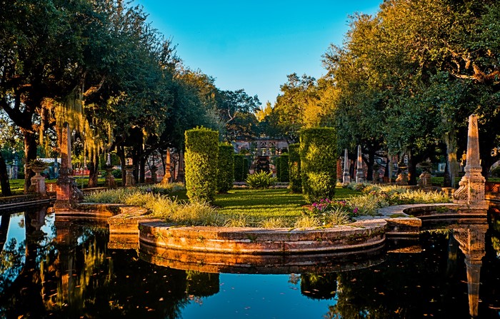Vizcaya Museum and Gardens pond with trees and shrubs