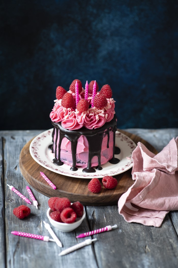 Pink Raspberry Cake with Chocolate Drizzle and Candles