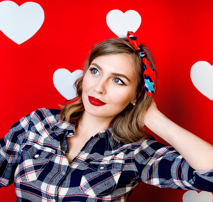 Woman with red bandana and plaid shirt