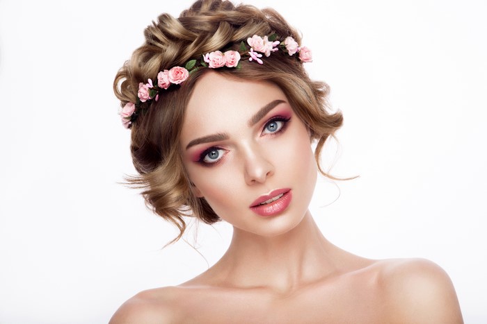 Woman with Flower Wreath and Pink Makeup