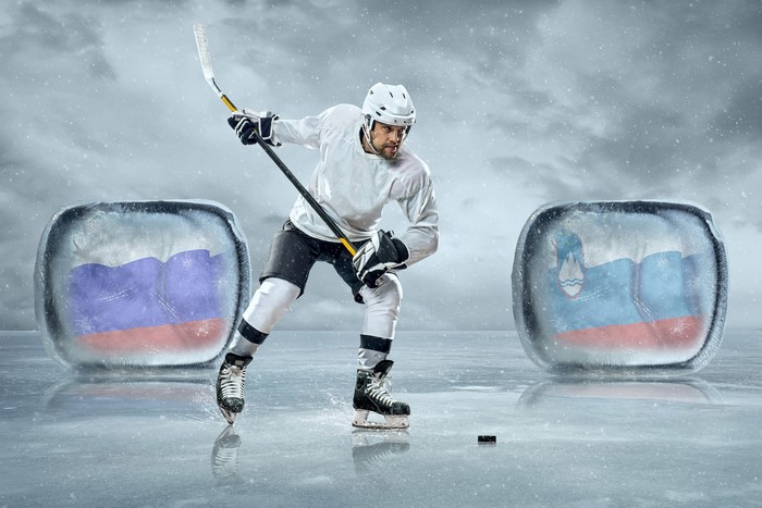 Hockey player with Russian and Slovenian flags in ice cubes