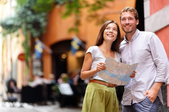 Couple with map in European city