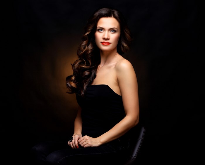Woman with brown hair sitting