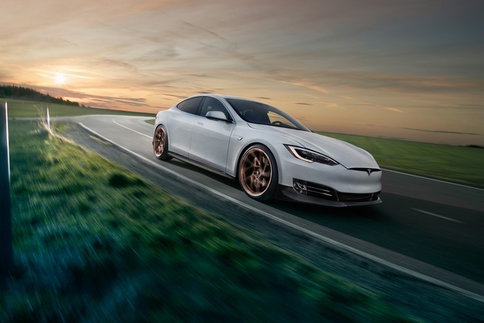 4K White Tesla Model S Novitec driving on a road