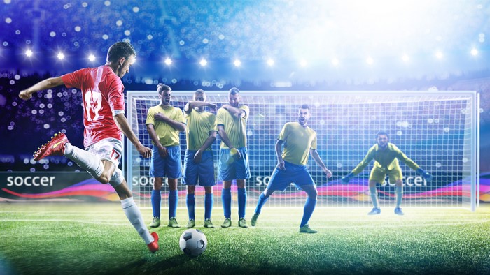 Soccer player taking a free kick