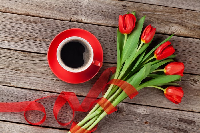Red Tulips and Coffee on Wood