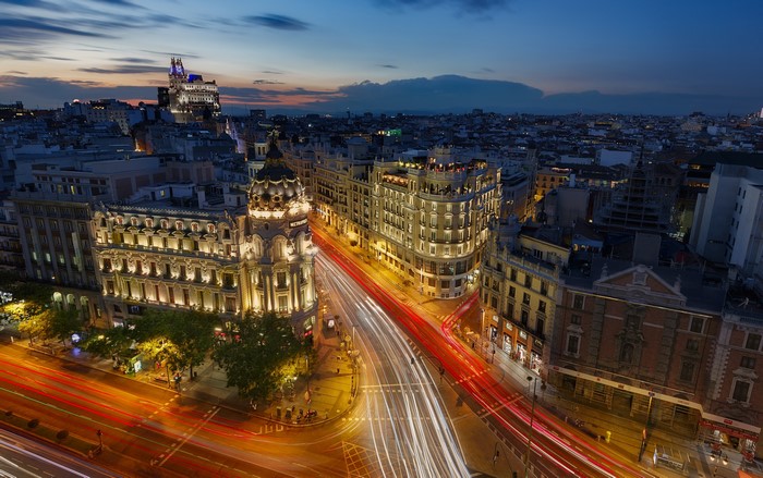 Madrid cityscape at dusk with light trails
