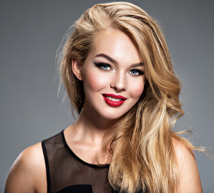 Blonde girl with red lips and makeup