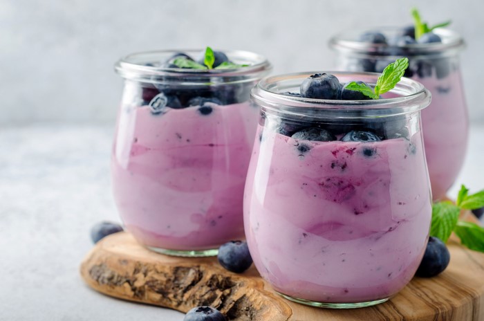 Blueberry yogurt in glass jars with mint