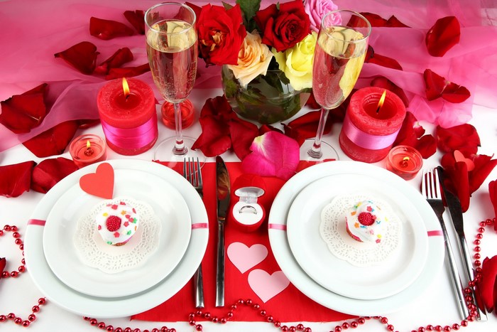 Romantic Dinner Table Setting with Champagne and Roses