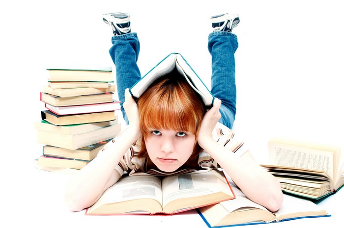 Girl with books on white background
