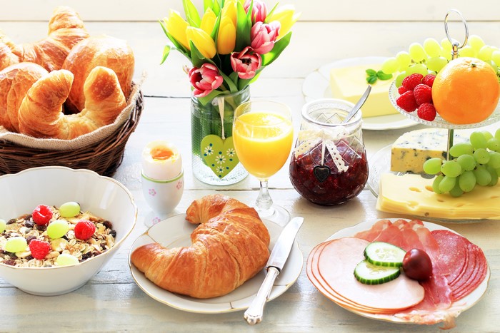 Breakfast with Croissants, Fruit, and Tulips