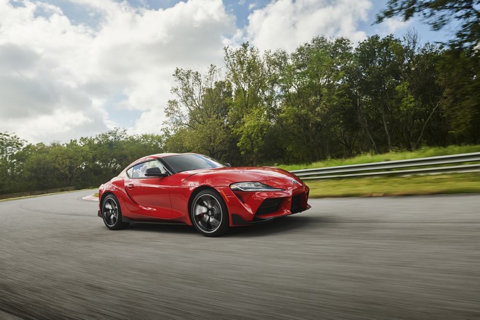 Red Toyota GR Supra on a Racetrack