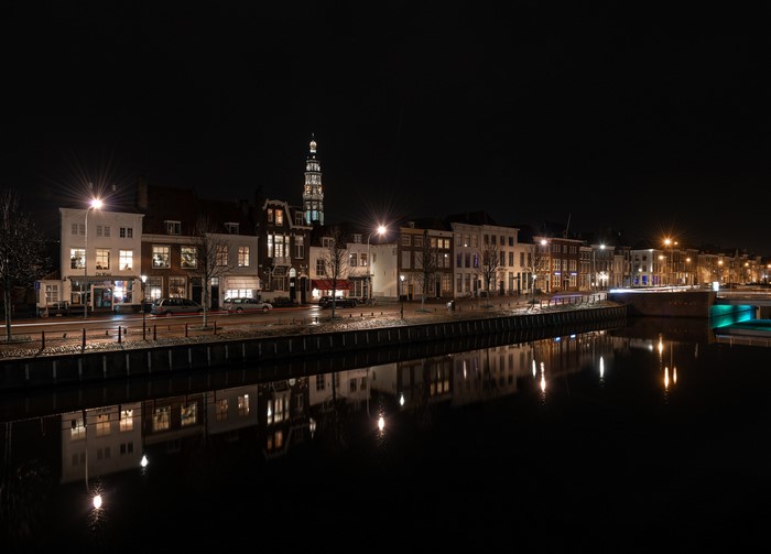 Houses along a canal in Middelburg at night