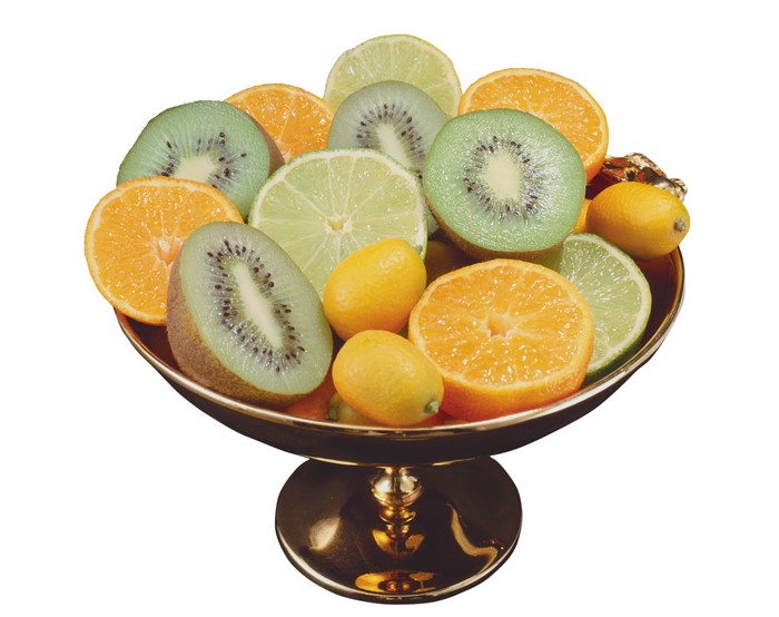 Bowl of sliced kiwi, oranges, limes, and kumquats