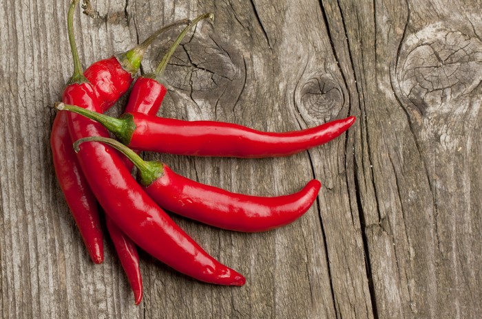 Red Chili Peppers on Wood Planks