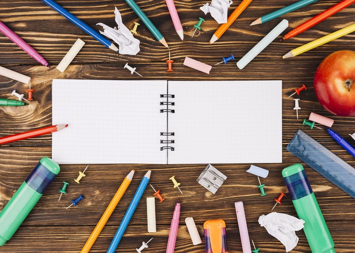School Stationery and Notebook on Wood