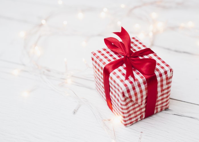 Gift box with red ribbon and lights