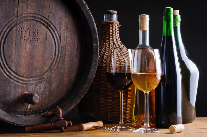 Wine barrel, bottles, and glasses
