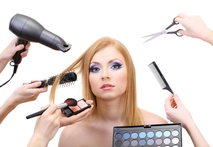 Blonde girl with makeup and hair dryer