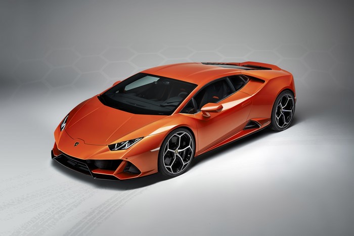 Orange Lamborghini Huracan EVO on gray background