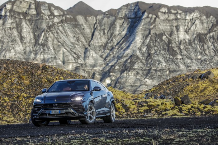 Lamborghini Urus in a rocky, mountainous landscape