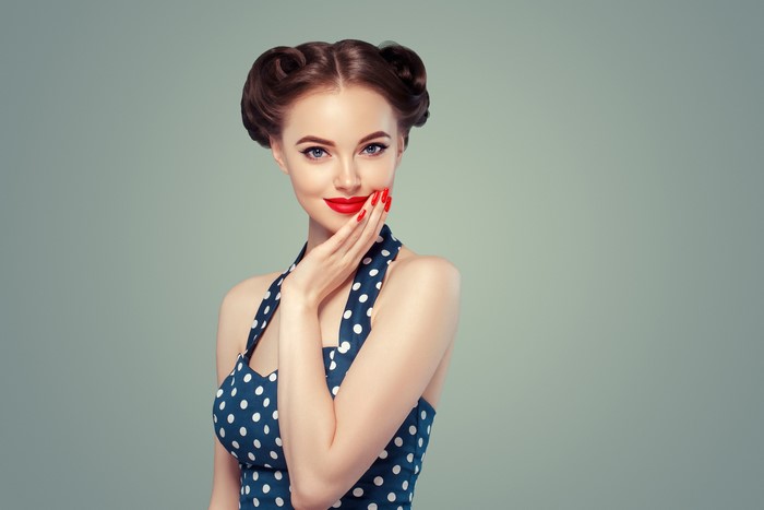 Woman with retro hairstyle and polka dot dress