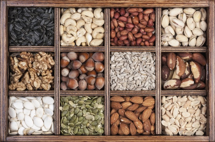 Assortment of nuts and seeds in a wooden box