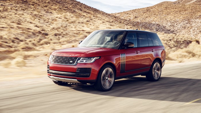 Red Land Rover Range Rover Driving