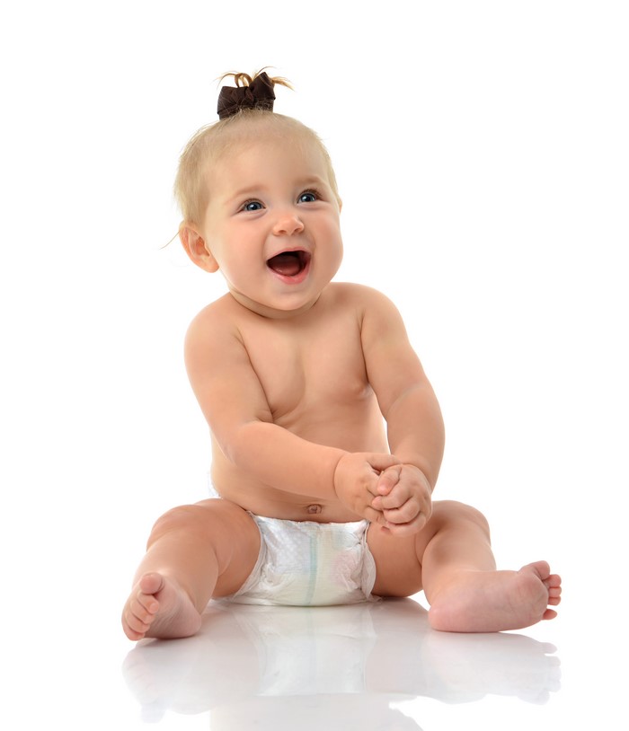 Baby sitting on white background