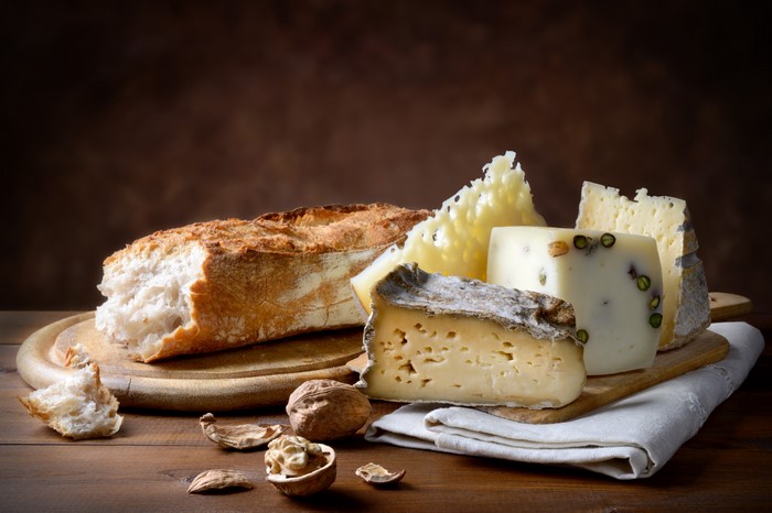 Cheese, Bread, Nuts, and Cutting Board