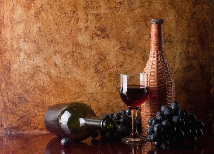 Wine bottle, glass, and grapes