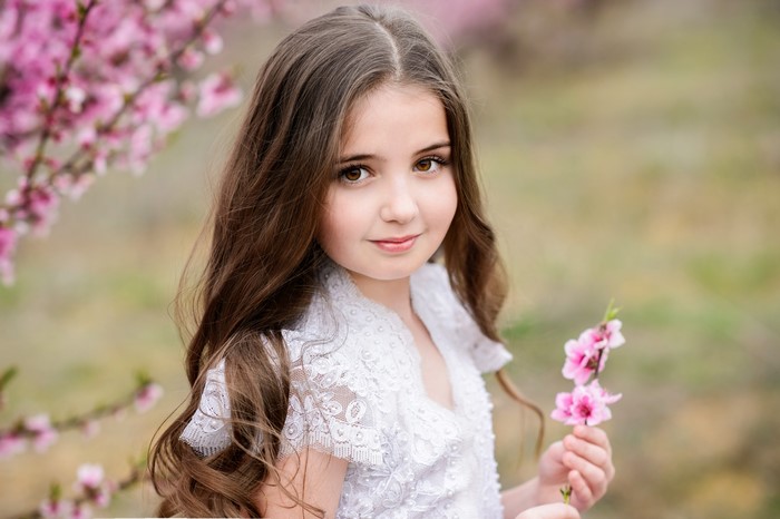 Cute Brown Haired Girl with Pink Flowers