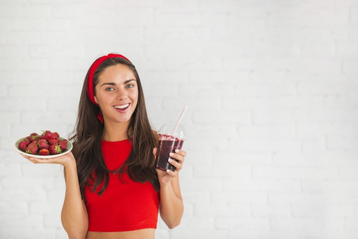 Woman with Strawberries and Smoothie