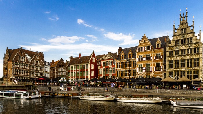 Ghent canal with historic houses and boats